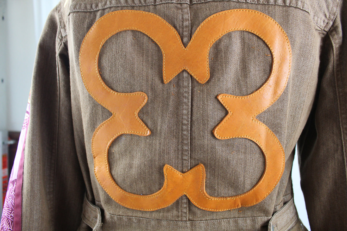 Upcycled jean jacket 12W Leather Applique Agyinduwura symbol & Ankara brown denim One-Of-A-Kind African Diaspora