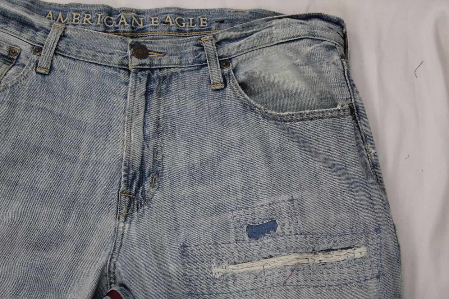 Upcycled American Eagle jeans 38 / 16 Plus Unisex embroidered Cameroon Atoghu Togh & Ankara One-Of-A-Kind African Diaspora
