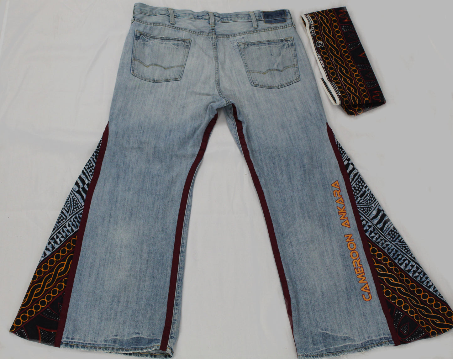 Upcycled American Eagle jeans 38 / 16 Plus Unisex embroidered Cameroon Atoghu Togh & Ankara One-Of-A-Kind African Diaspora